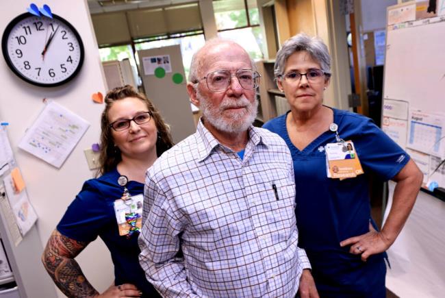 Dr. Allan Bernstein with clinical research assistant Lauren Weber, left, and  clinical research coordinator Teresa Lund are involved with the next phase of clinical trials, Thursday, Aug. 3, 2023 of donanemab, which has showed results slowing the advance of Alzheimer's disease.  (Kent Porter / The Press Democrat) 2023