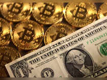 Illustration shows representations of cryptocurrency Bitcoin and U.S. dollar