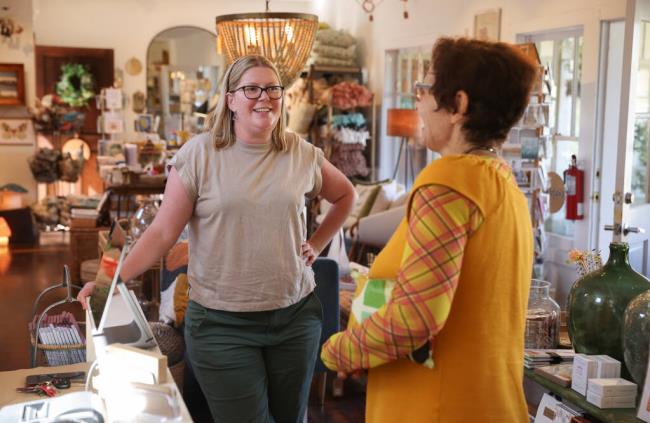 Acorn owner Emily Lynch, left, talks with customer Roxanne Sherif at her Duncans Mills store location on Thursday, August 10, 2023.  (Christopher Chung/The Press Democrat)