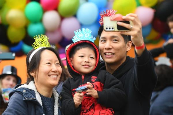 Visitors enjoy the Noon Year’s Eve event at the Discovery...