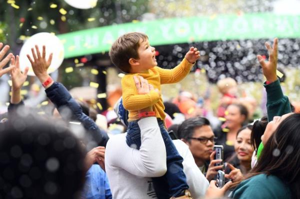 Alina Calloway enjoys the balloon drop with her family during...