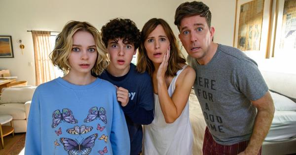 Jennifer Garner, Ed Helms, Emma Myers, and Brady Noon looking in the mirror with shocked faces in Netflix's Family Switch