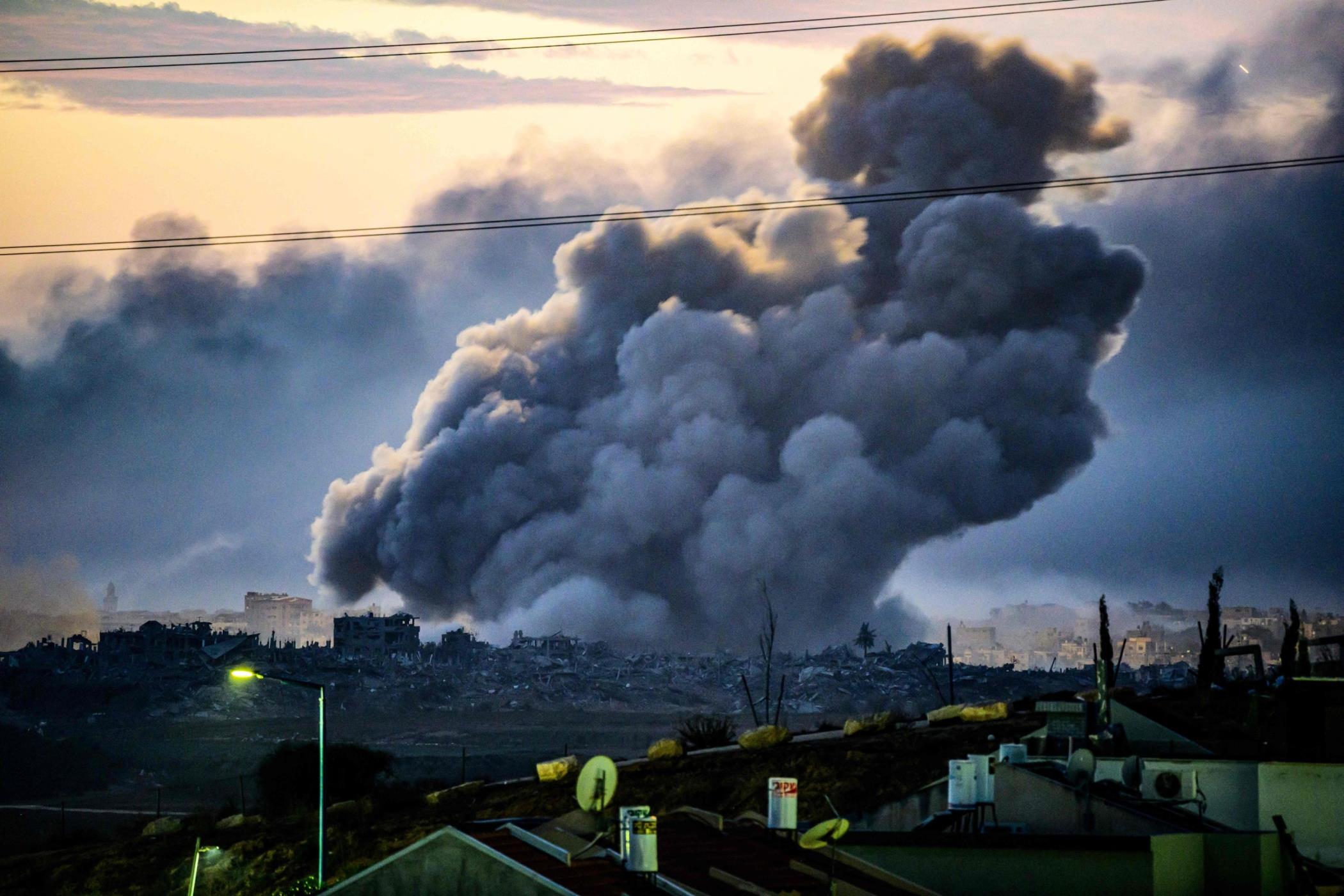 Smoke rising above buildings during Israeli Strikes on northern Gaza, Palestine, Nov. 22, 2023. (AFP Photo)