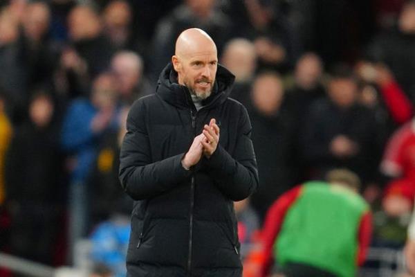 Manchester United's head coach Erik ten Hag applauds during the English Premier League soccer match between Liverpool and Manchester United