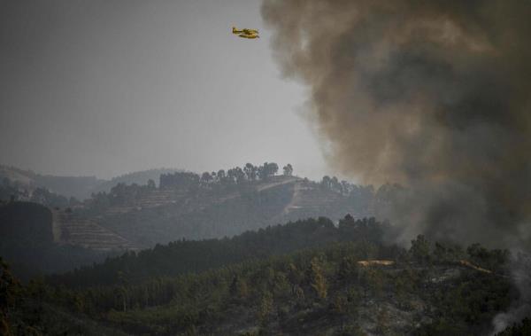 Temperatures soar in Iberia as wildfires force evacuation in Portugal
