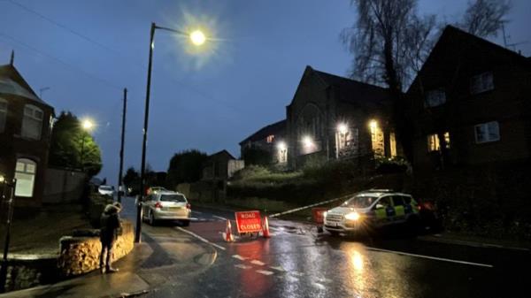 A police cordon on Scott Road, Burngreave, after a 46-year-old man died and several others were injured after a car hit a crowd of people during violence in Sheffield. A 23-year-old man has been arrested on suspicion of murder and a 55-year-old man on suspicion of attempted murder, South Yorkshire Police said. Picture date: Thursday December 28, 2023.