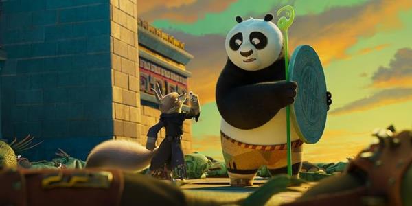 Kung Fu Panda 4 scene featuring Jack Black as Po holding a shield