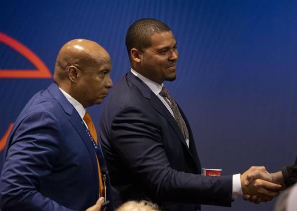 President and CEO Kevin Warren, left, and general manager Ryan Poles greet people April 25, 2023, at Halas Hall.